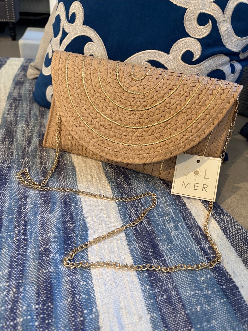 Sol And Mer Woven Straw Fold-Over Clutch in Natural Tan w chain and gold detail